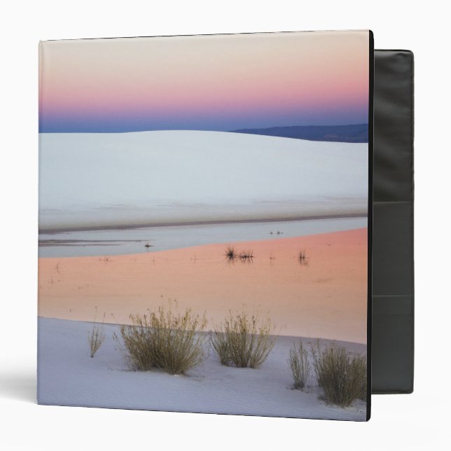 Dusk sky reflected in pool of water from binder (Front/Inside)