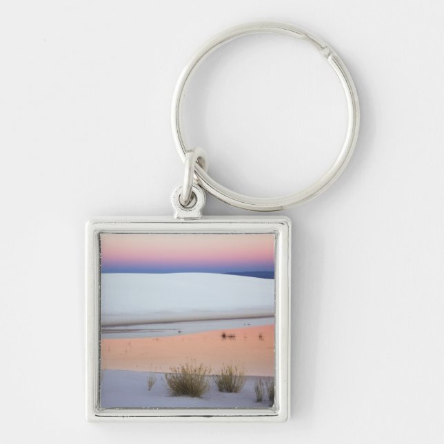 Dusk sky reflected in pool of water from keychain (Front)
