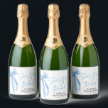 Dusty Blue Bow She's Tying the Knot Bridal Shower  Sparkling Wine Label<br><div class="desc">Celebrate the bride-to-be with the "She's Tying the Knot" Bridal Shower theme, elegantly adorned with a dusty blue bow design. This refined and stylish theme sets the perfect tone for a sophisticated bridal shower, blending seamlessly with your event decor. The dusty blue bow adds a touch of grace and charm,...</div>