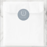 Dusty Blue Crest Modern Monogram Wedding  Classic Round Sticker<br><div class="desc">Add a touch of elegance to your wedding with the Dusty Blue Crest Modern Monogram Wedding Classic Round Sticker. Featuring a soft dusty blue background, a refined crest emblem, and a personalized monogram, this sticker is perfect for enhancing your wedding invitations, favours, or stationery. Its gentle, modern design makes it...</div>