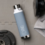 Dusty Blue Modern Typography Personalized Water Bottle<br><div class="desc">Trendy, vacuum insulated water bottle that features personalized name in white, modern typography on a trendy, dusty blue colour background. Personalize bottle by editing name and replacing name with your own as desired. Perfect for a birthday gift, wedding groomsman gift, etc. Select your water bottle style. Select your water bottle...</div>