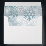 Dusty Blue Snowflake Modern Wedding Envelope<br><div class="desc">This design features a soft bokeh blue sky highlighting a snowfall on a bed on white. This design is part of the Dusty Blue Snowflake Modern Wedding Suite Collection.</div>