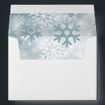 Dusty Blue Snowflake Modern Wedding Envelope<br><div class="desc">This design features a soft bokeh blue sky highlighting a snowfall on a bed on white. This design is part of the Dusty Blue Snowflake Modern Wedding Suite Collection.</div>