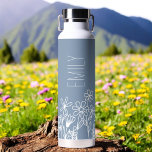 Dusty Blue Wildflower Garden Monogram Name Water Bottle<br><div class="desc">Quench your thirst in style with our exquisite Wildflower Garden Monogram Name Water Bottle. Crafted with durability and elegance in mind, this sleek bottle is adorned with a breathtaking wildflower garden design, evoking the beauty of nature. Personalize your bottle with your monogram and name to make it uniquely yours or...</div>