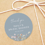 Dusty Blue Wildflower Thank You Bridal Shower Classic Round Sticker<br><div class="desc">Express gratitude with our Wildflower Thank You Bridal Shower In Bloom Classic Round Sticker. These charming stickers feature a delightful wildflower design, infusing a touch of natural beauty into your bridal shower thank-you notes or favours. The classic round shape adds versatility, making them perfect for various uses, from sealing envelopes...</div>