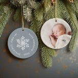 Dusty Blue Winter Snowflake First Christmas Photo Ceramic Ornament<br><div class="desc">Ceramic holiday ornament personalized with your baby's photo and custom "My First Christmas" text. This simple modern holiday design features a white snowflake on a dusty blue background. Use the design tools to choose any background colour, edit text fonts and colours and add your own photos to create your own...</div>