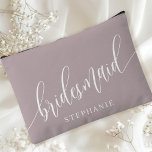 Dusty Lavender Bridesmaid Modern Calligraphy Accessory Pouch<br><div class="desc">Celebrate your bridal party with this elegant dusty lavender purple bridesmaid accessory pouch. Featuring modern calligraphy and customizable with your bridesmaid's name, this pouch is both stylish and practical. The soft dusty sage colour and elegant script create a sophisticated look, perfect for holding makeup, toiletries, or other essentials. This personalized...</div>