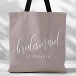 Dusty Lavender Bridesmaid Modern Script Tote Bag<br><div class="desc">Show your appreciation to your bridal party with this stylish dusty lavender purple bridesmaid tote bag. Featuring modern script and customizable with your bridesmaid's name, this tote bag is both practical and elegant. The soft colour and chic design make it perfect for carrying wedding day essentials or everyday items. This...</div>