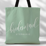 Dusty Mint Bridesmaid Modern Script Tote Bag<br><div class="desc">Show your appreciation to your bridal party with this stylish dusty mint green bridesmaid tote bag. Featuring modern script and customizable with your bridesmaid's name, this tote bag is both practical and elegant. The soft colour and chic design make it perfect for carrying wedding day essentials or everyday items. This...</div>