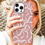 Dusty Rose Bow Monogram iPhone 16 Pro Max Case<br><div class="desc">Dress up your phone in style with this chic and trendy dusty rose phone case! Featuring a playful pattern of hand-drawn bows and personalized with your monogram, this case is the perfect blend of fashion and function. Made from durable materials to protect your phone from everyday bumps and scratches. A...</div>