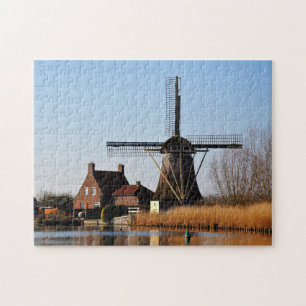 Dutch mill by the water's edge. jigsaw puzzle