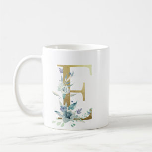 E golden initial with blue floral foliage coffee mug