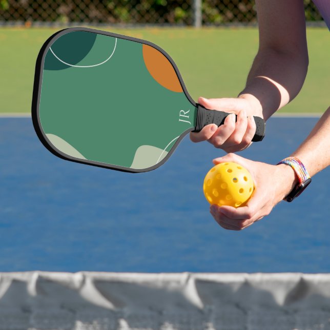 Earth tone organic shapes pickleball paddle (Insitu)