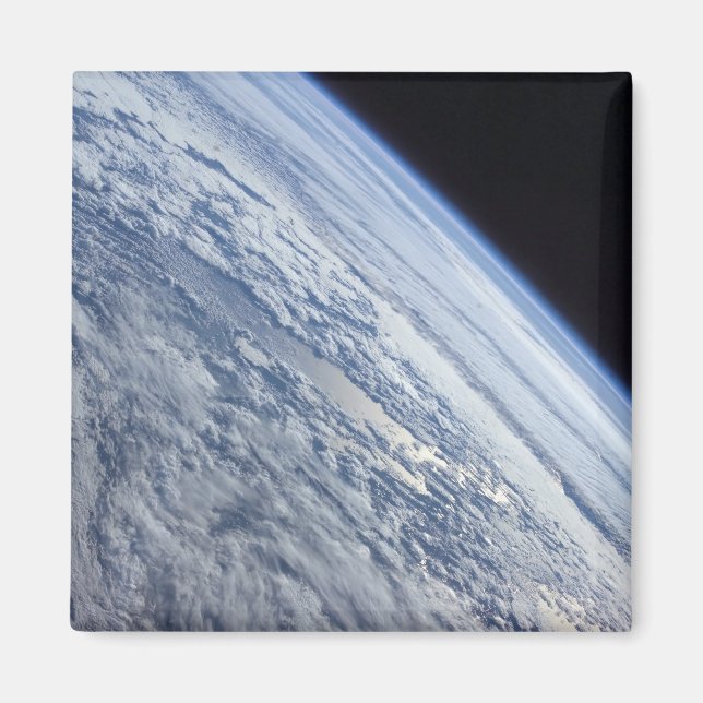 Earth's horizon against the blackness of space magnet (Front)