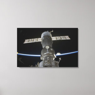Earth's limb intersects a Soyuz spacecraft Canvas Print