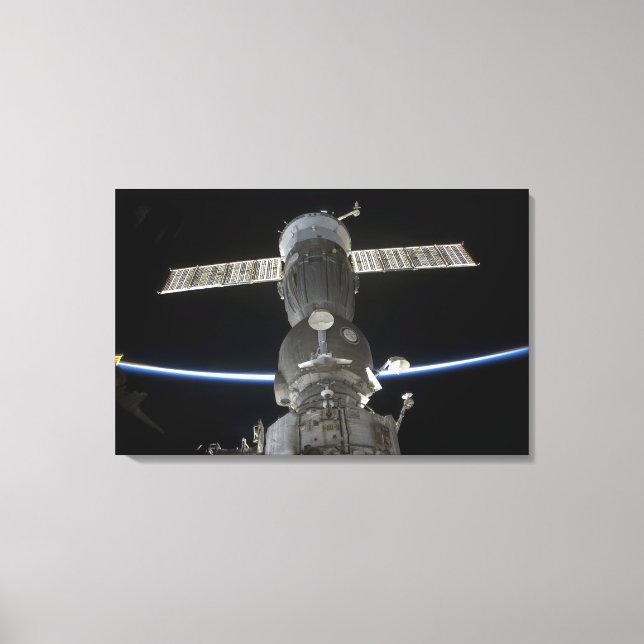 Earth's limb intersects a Soyuz spacecraft Canvas Print (Front)