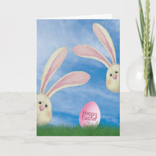 Easter bunnies with pink egg in grass card