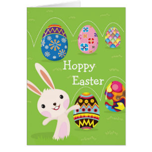 Easter bunny playful with painted eggs