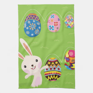 Easter bunny playful with painted eggs kitchen towel