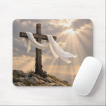 Easter Cross with Shroud at Sunrise Mouse Pad<br><div class="desc">A wooden cross wrapped in white fabric stands on a rocky hill,  bathed in warm sunlight that pierces through the clouds</div>