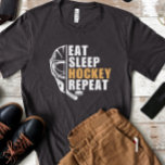 Eat Sleep Hockey Repeat T-Shirt<br><div class="desc">Eat sleep hockey repeat black tshirt. a funny hockey lover birthday gift for husband,  dad,  grandpa,  son,  brother or friend who is a hockey player or hockey fan.</div>