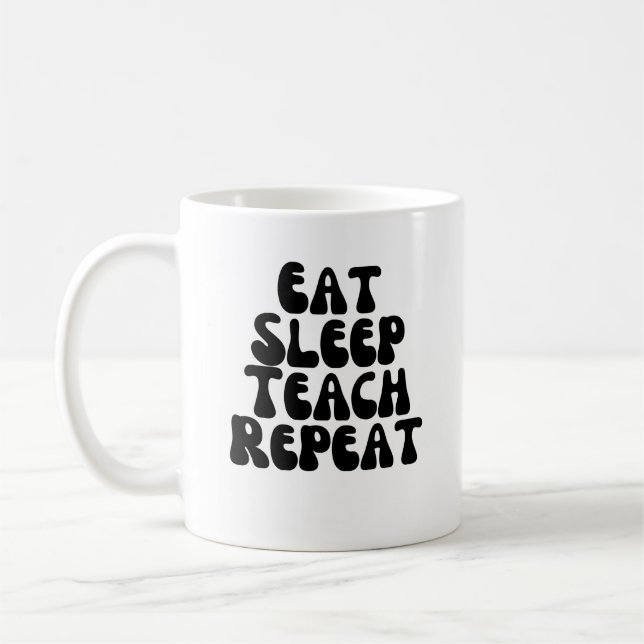 Eat sleep teach repeat coffee mug (Left)