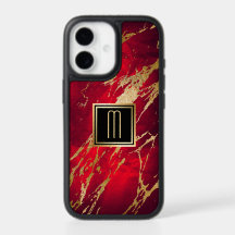 Éclaboussure de peinture de monogramme d'or sur le