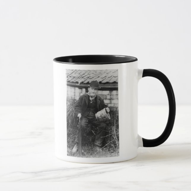 Edward Bingham holding one of his Castle Mug (Right)