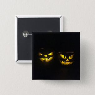 Eeire yellow glow on black creepy pumpkin faces 2 inch square button