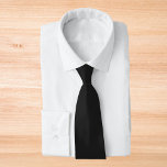 Eerie Black Solid Color Tie<br><div class="desc">An intense and sophisticated deep black that exudes timeless elegance.Perfect for those seeking to make a bold statement.This powerful hue captures the essence of mystery and sophistication.This rich black color is the ultimate choice for a striking and refined aesthetic.</div>