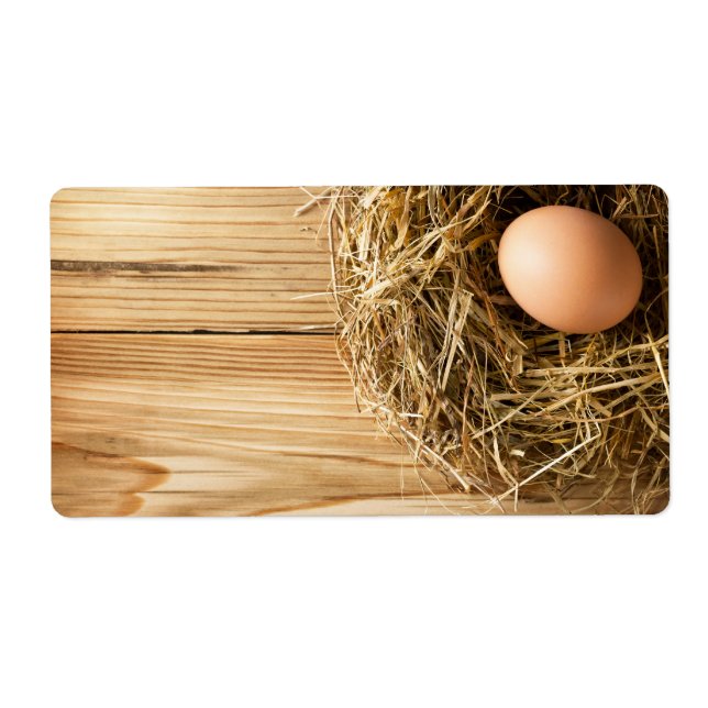 Egg In Hay Nest On Wooden Table Background (Front)