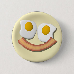Eggs and bacon face . 2 inch round button