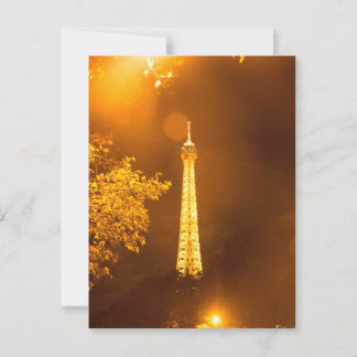 Eiffel Tower lit by street lantern at night Postcard