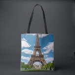 Eiffel Tower View from Champ de Mars Public Park Tote Bag<br><div class="desc">Paris France Eiffel Tower seen from Champ de Mars park with green lawn and visitors under sunny sky</div>