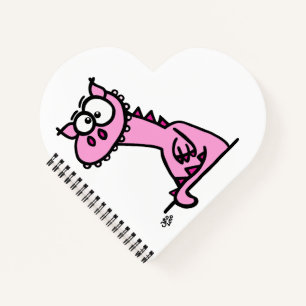 Ein niedlicher Drache in rosa Notebook