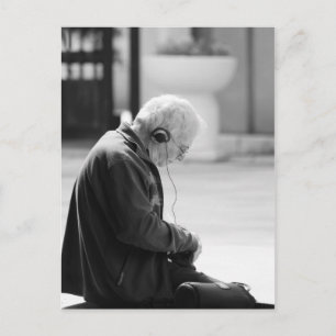 Elder man listen a music postcard