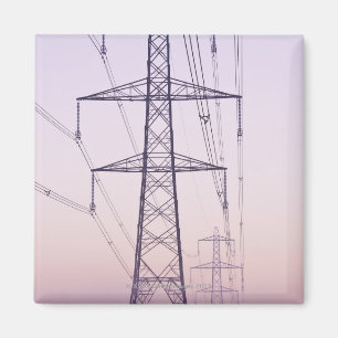 Electricity pylons in mist at dawn. magnet