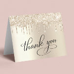 Elegant 70th Birthday Party Gold Glitter Thank You Card<br><div class="desc">Chic 70th birthday party folded thank you card featuring "Thank You" in elegant calligraphy,  a gold faux foil background and gold faux glitter. Personalize your thank you message and signature on the inside,  or leave blank for a handwritten note.</div>