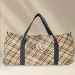 Elegant beige plaid pattern monogram duffle bag<br><div class="desc">Introducing the Plaid Pattern Monogram Duffel Bag designed by PixeliaDesigns, where fashion meets practicality. Boasting a timeless plaid design in understated beige hues, this duffel is elevated with a custom monogram in a sophisticated font, catering to both men and women. Perfect for a range of activities, including dance, sports, and...</div>
