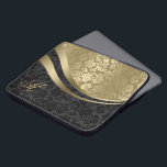 Elegant Black And Gold Damasks Dynamic Stripes 2 Laptop Sleeve<br><div class="desc">Elegant gold tones and black vintage floral damasks combination with gold dynamic lines accents</div>