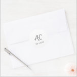 Elegant Black and White Clean Wedding Classic Round Sticker<br><div class="desc">Classic wedding stickers featuring a simple design with your two initial monogram in an elegant handwriting script for a modern touch.  The colour palette may be changed in the design editing tool.</div>