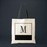 Elegant Black and White Monogram Bag<br><div class="desc">If you're looking for a bridesmaid bag or a unique personalized bridesmaids gift idea, these elegant little black and white bags are the answer! The bag is available in all different sizes, and come in a white background with a large black colour block on the bottom. Each bag can be...</div>