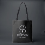 Elegant Black and White Personalized Bridesmaid Tote Bag<br><div class="desc">Elegant Black and White Personalized Bridesmaid Gifts
featuring personalized monogram in elegant calligraphy font style with bridesmaid's name and title in classic serif font style.

Also perfect for Maid of Honour,  Flower Girl,  Mother of the Bride and more.</div>