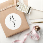Elegant Black and White Wedding Monogram Classic Round Sticker<br><div class="desc">Celebrate your union with our Elegant Black and White Wedding Monogram Classic Round Sticker, a perfect emblem of your love story. This sophisticated design features the intertwined initials "H" and "J", symbolizing the beautiful joining of two lives. Crafted with a minimalist aesthetic, this sticker blends contemporary elegance with timeless charm,...</div>