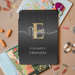 Elegant Black Brushed Metal Gold Monogram Trendy iPad Mini Cover<br><div class="desc">Elevate your iPad Air with our Elegant Black Brushed Metal Gold Monogram Trendy iPad Air Cover! Crafted from sleek black brushed metal, this cover exudes modern sophistication. Personalize it with your monogram in bold gold text and your script name in elegant white typography, adding a touch of personalized elegance to...</div>