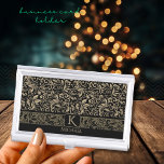 Elegant Black& Gold Floral Monogram Business Card Holder<br><div class="desc">Beautiful Modern Gold Floral Pattern on a Black background with a monogram and name on this business card holder. Both can be easily updated, if you want to keep the Monogram without the name, delete the name in the personalization field. You can find a matching tie, a lighter, and socks...</div>