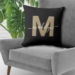 Elegant Black Gold Initial Name Monogram Throw Pillow<br><div class="desc">Personalized Black and Gold Initial Name Monogram Throw Pillow. This chic monogram pillow merges modern minimalist style with a sophisticated edge, making it a versatile accent for any room. It features a bold, flat gold initial in a warm brown hue (no foil or shimmer) on a sleek black background, complemented...</div>