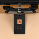 Elegant black gold monogram and name script  luggage tag<br><div class="desc">Luxury elegant modern monogram and signature script name personalized luggage tag featuring a faux metallic gold copper square with name initial over a black leather like (PRINTED TEXTURE) background.              Could be a stylish birthday,  wedding,  Christmas,  or any other occasion or anniversary gift.</div>