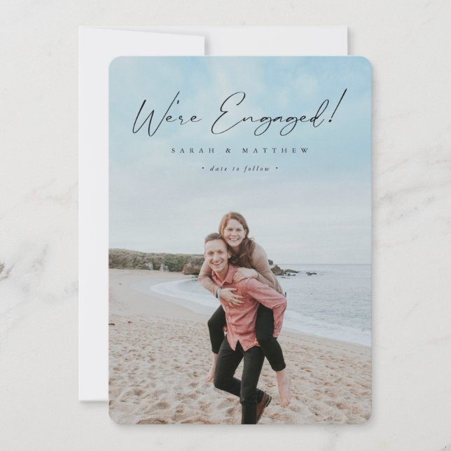 Elegant Black Hand Written Script Engagement Photo Announcement (Front)