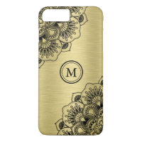 Elegant black mandala on metallic gold background